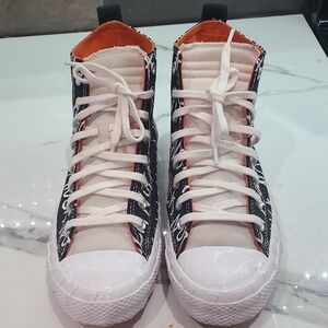 Converse Black and White High-Tops with Orange Interior
